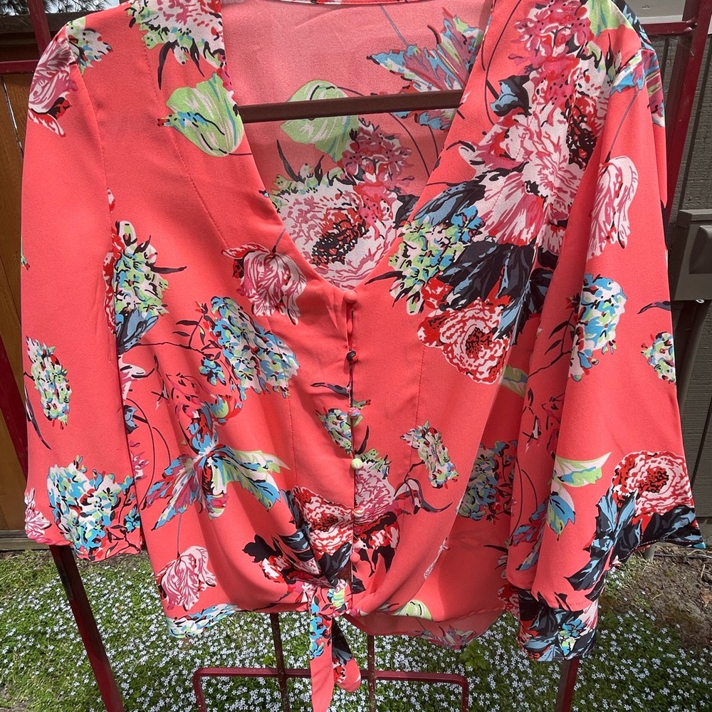 Colorful flowered blouse.